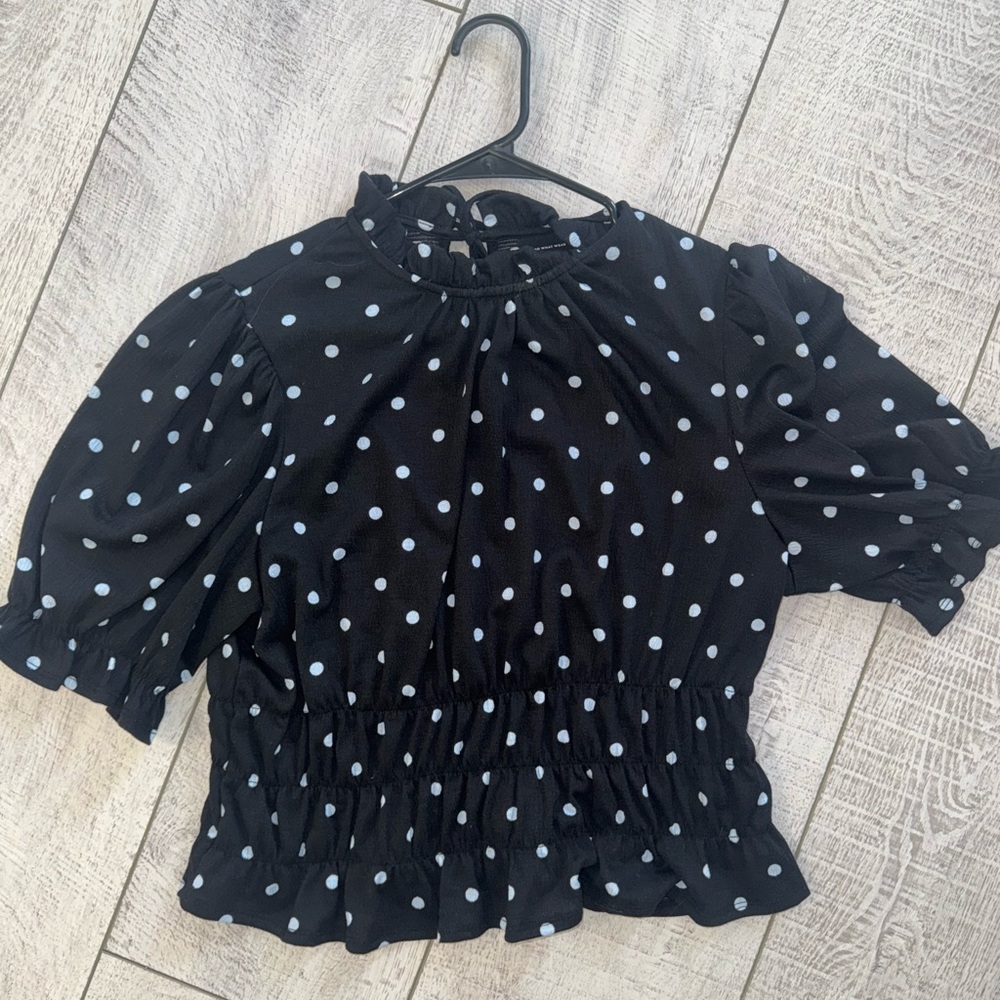 Dark blue polka dot blouse with tie in back. Size large: never worn